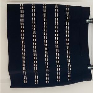 Black mini skirt with gold stuffing on both sides